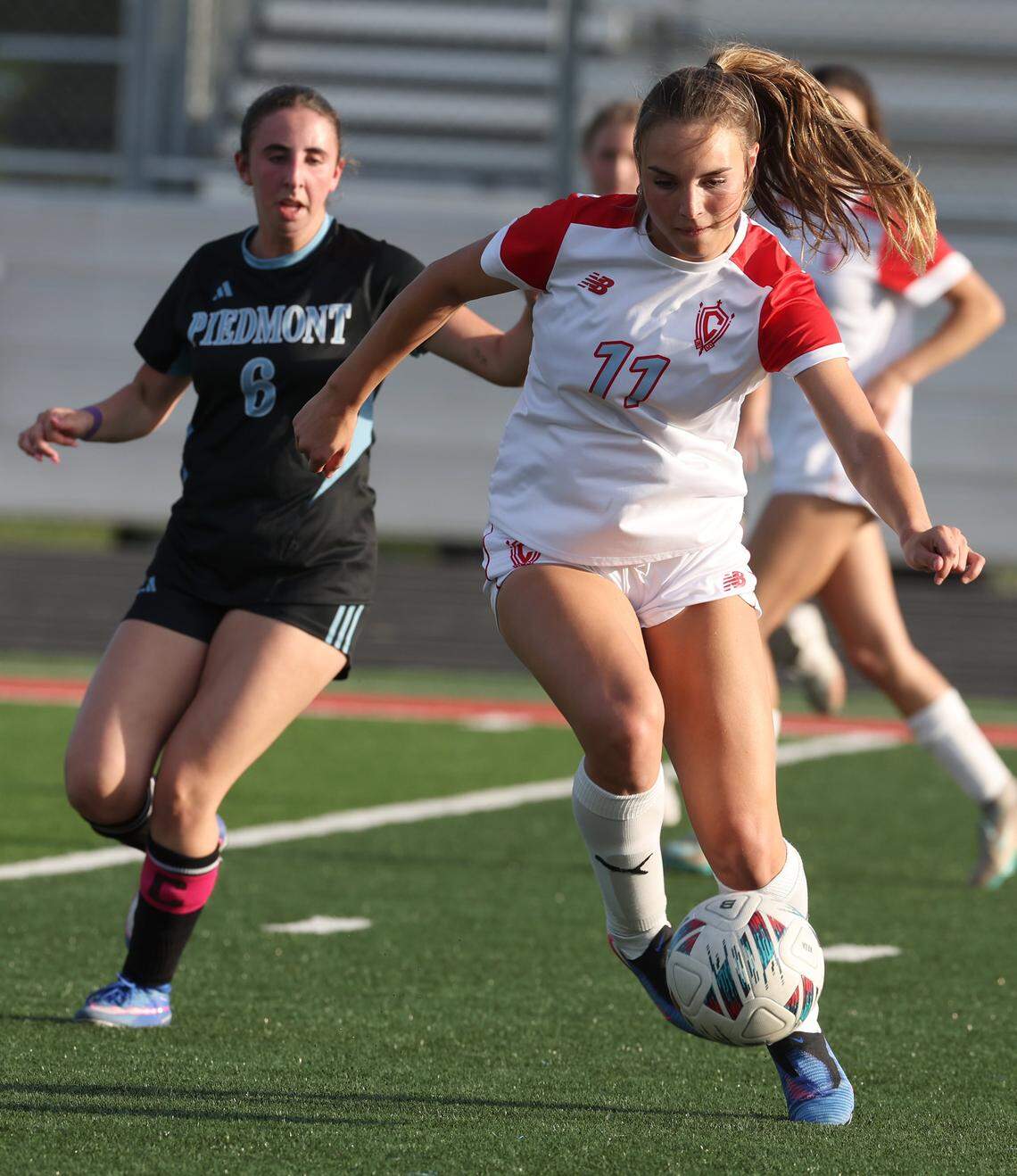 Charlotte Catholic's Savanna Leckner takes control of the ball during action against Piedmont on Wednesday, April 15, 2026. Charlotte Catholic is ranked No. 4 in the nation by MaxPreps.