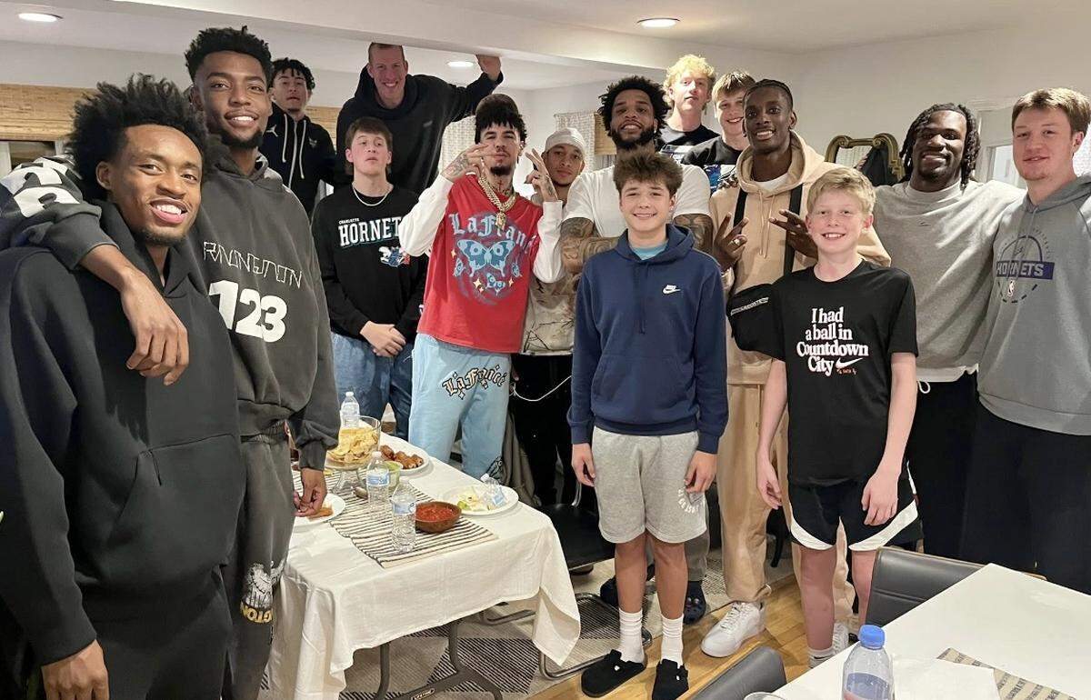 The entire Charlotte Hornets team went over to the Knueppel house for dinner in Milwaukee in November 2025. Chari Nordgaard Knueppel said she cooked 25 pounds worth of chicken fajitas for the event. LaMelo Ball is in the red T-shirt in the center of photo; Kon Knueppel is at the far right.