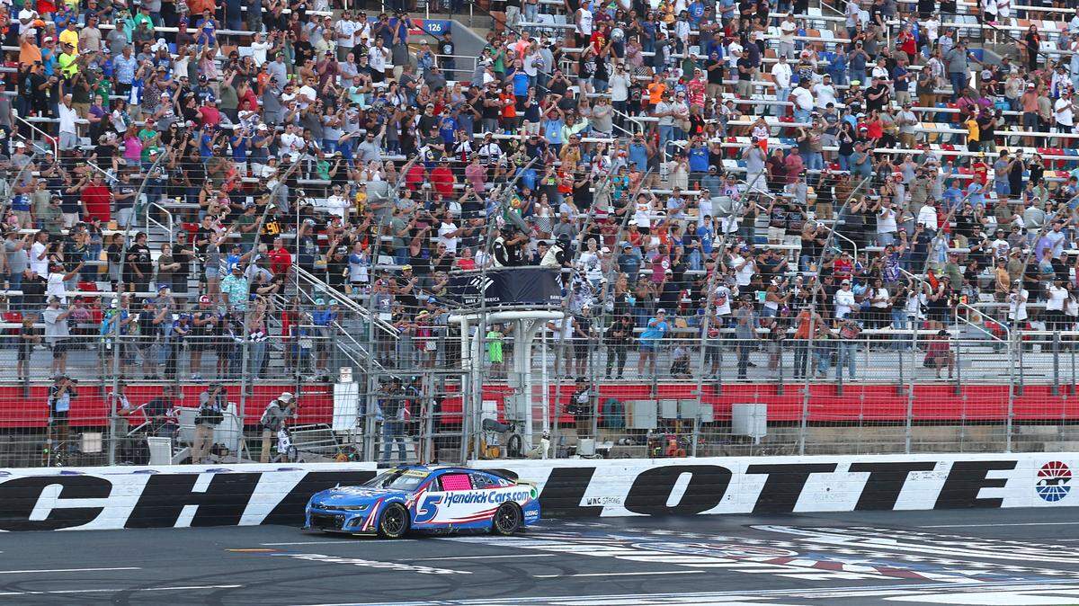NASCAR driver Kyle Larson crosses the finish line to win the Bank of America Roval at Charlotte Motor Speedway in Concord, NC on Sunday, October 13, 2024.