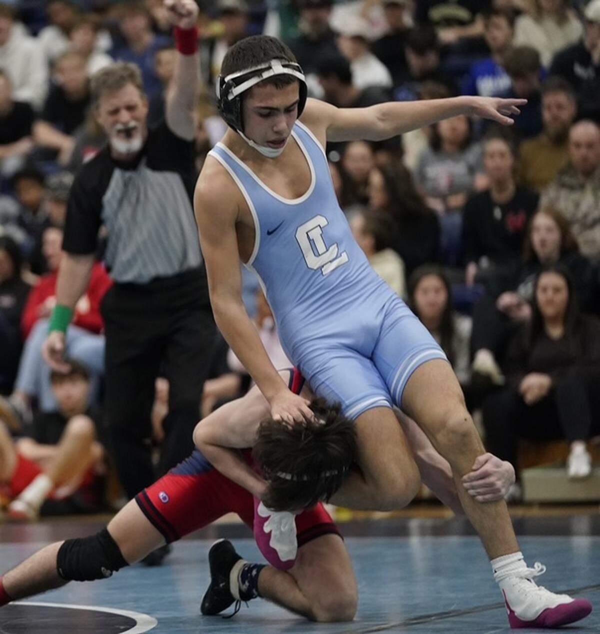 Charlotte Latin's Dino Lambos, right, tries to get out of a leg hold by Providence Day's Aidan Schirra during their 120-pound championship match Saturday at the N.C. Independent Schools Athletic Association's state championships in Charlotte. 
