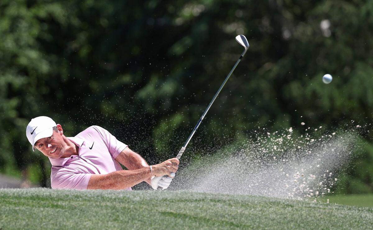 Rory McIlroy watches his shot from a sand trap along the third fairway during the final round of the Wells Fargo Championship at Quail Hollow Club in Charlotte, NC on Sunday, May 12, 2024.