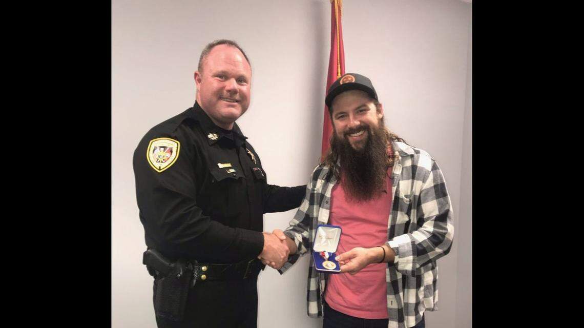Brandon Keller, right, just won his second Citizen Lifesaving Award in Tennessee. Sullivan County Sheriff Jeff Cassidy presented him with the honor.