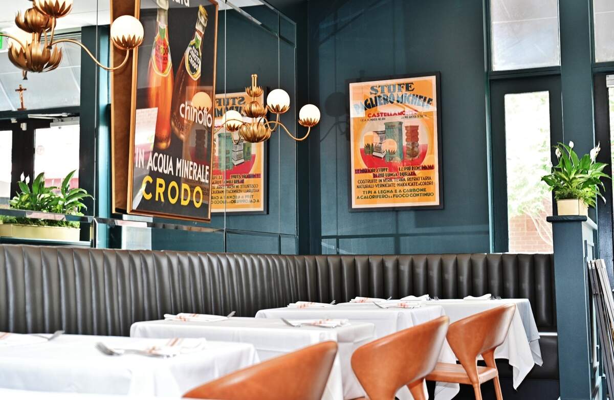 The deep blue color for the walls was chosen to evoke a warm, intimate feel to match the food.