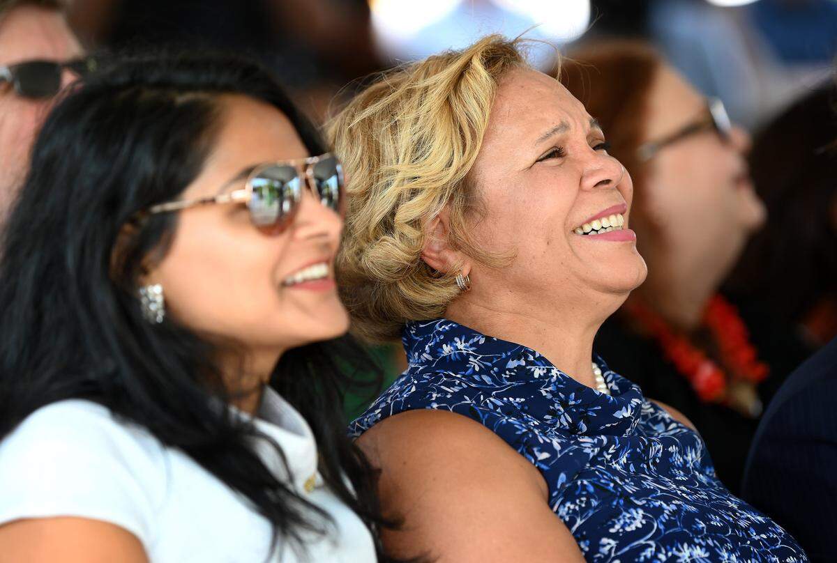 Charlotte Mayor Vi Lyles, right and council member Dimple Ajmera, left, laugh during a ceremony for developer Crosland Southeast’s mixed-use project on the long dormant Eastland Mall site on Wednesday, August 3, 2022. 