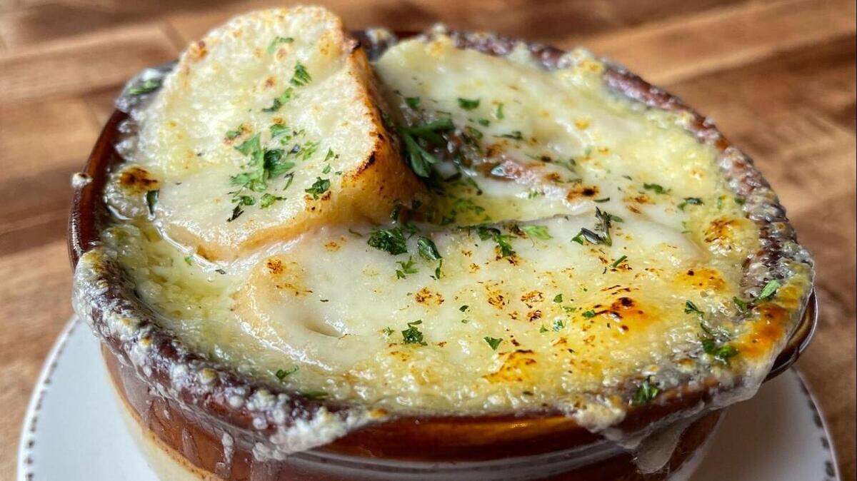 Crepe Cellar’s French Onion Soup is topped with melted gruyère and crostini.