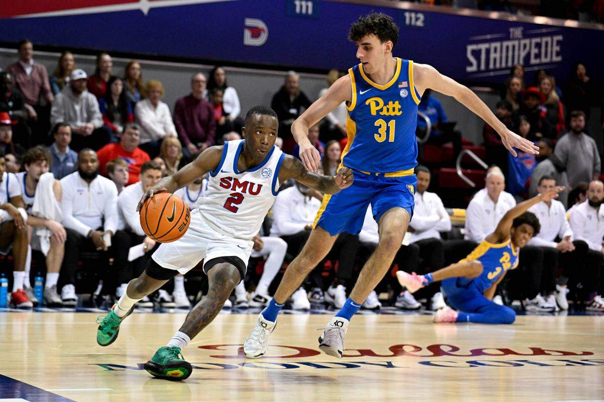 Feb 11, 2025; Dallas, Texas, USA; Southern Methodist Mustangs guard Boopie Miller (2) moves the ball past Pittsburgh Panthers forward Jorge Diaz Graham (31) during the second half at Moody Coliseum.