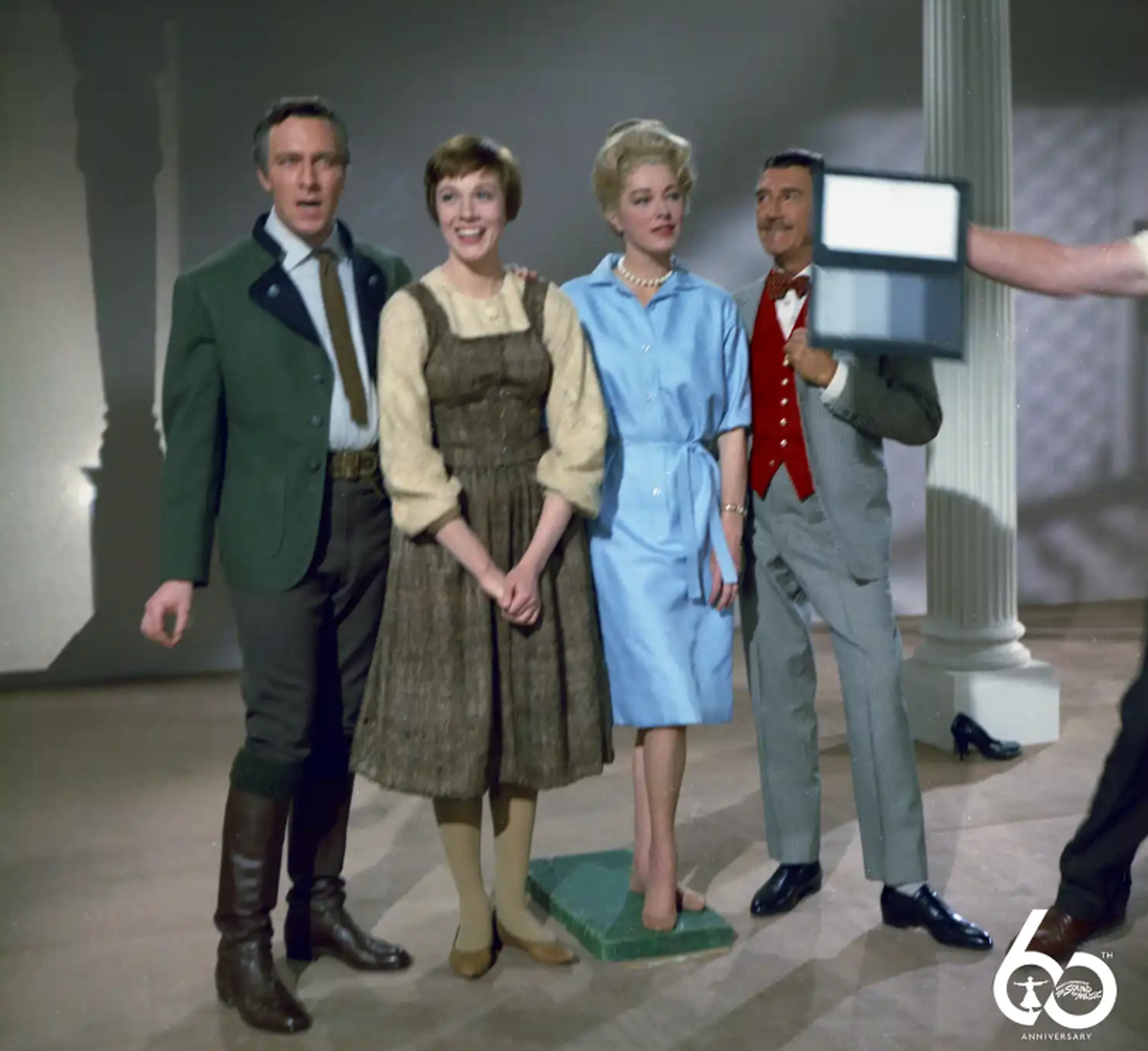 Here’s a behind the scenes look at a wardrobe test for, from left, Christopher Plummer as Captain Georg von Trapp, Julie Andrews as Maria, Eleanor Parker as the Baroness and Richard Hayden as Max Detweiler. Parker’s blue dress did not make the final cut.