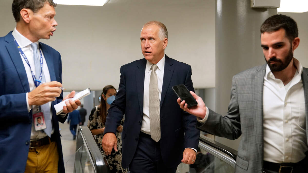 Sen. Thom Tillis, R-N.C., center, speaks with reporters on Capitol Hill in Washington on June 9, 2022.