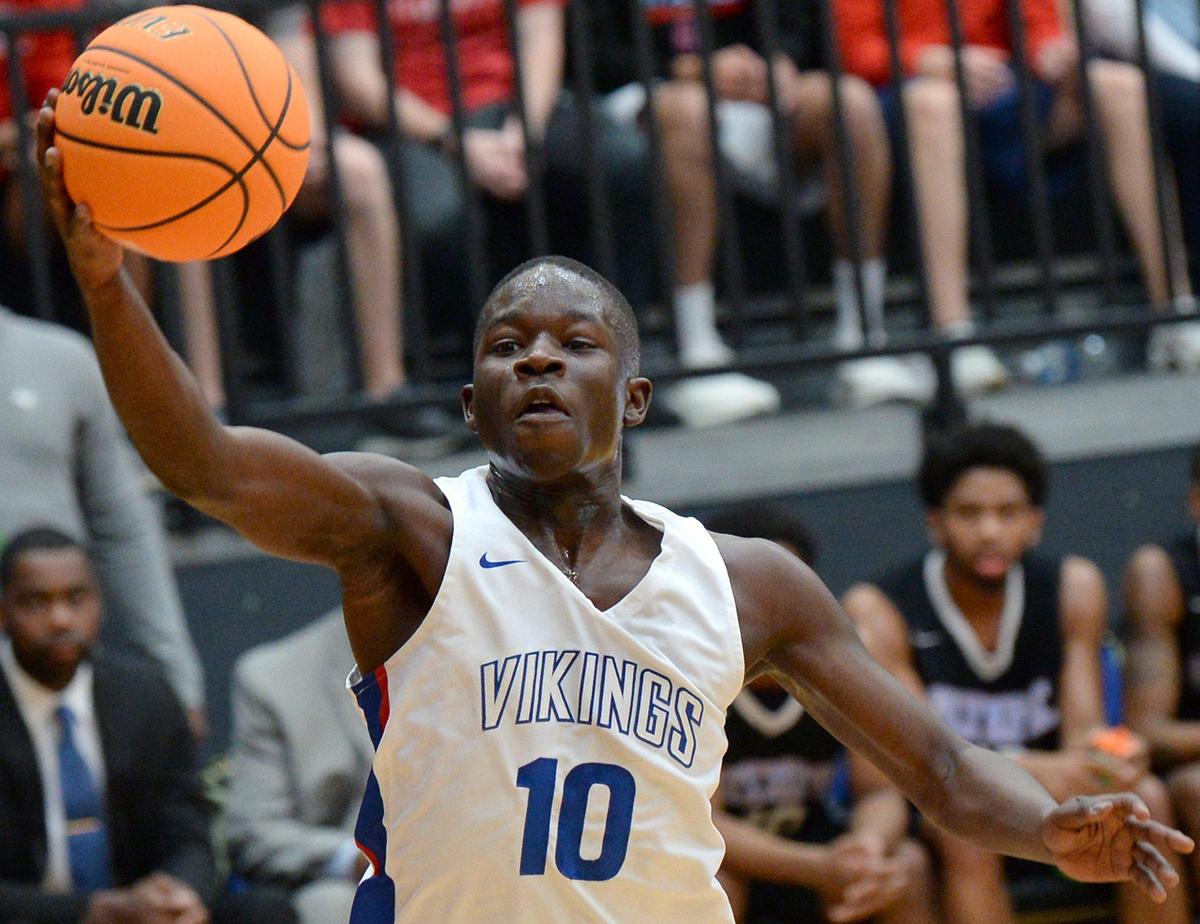 North Meck’s Shamann Artis maintains control of the ball during first half action against Olympic in the Men’s 4A Western Regional game at Lenoir-Rhyne in Hickory, NC on Saturday, March 7, 2020. North Meck defeated Olympic 86- 78.