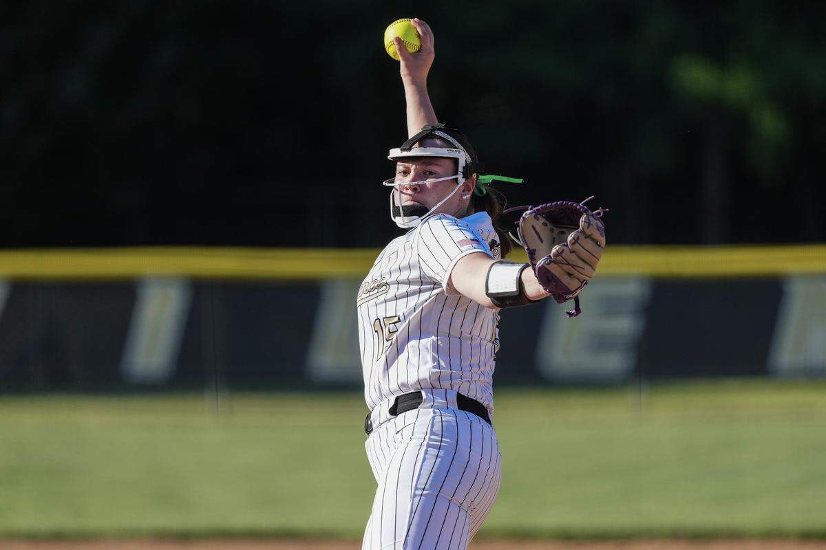Providence's Sophie Strugar (15) throws a pitch during the first inning of a NCHSAA girls playoff softball game against West Forsyth, Tuesday, May 19, 2026, in Charlotte, N.C.