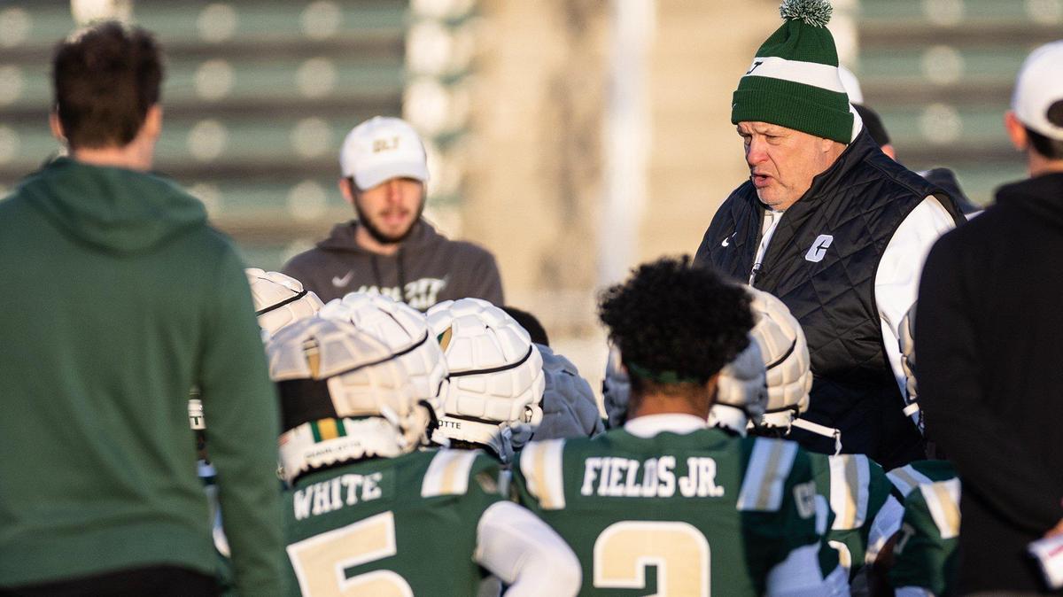 UNC Charlotte coach Biff Poggi coaches during his first practice at the Jerry Richardson Stadium in Charlotte, N.C., on Tuesday, March 21, 2023.