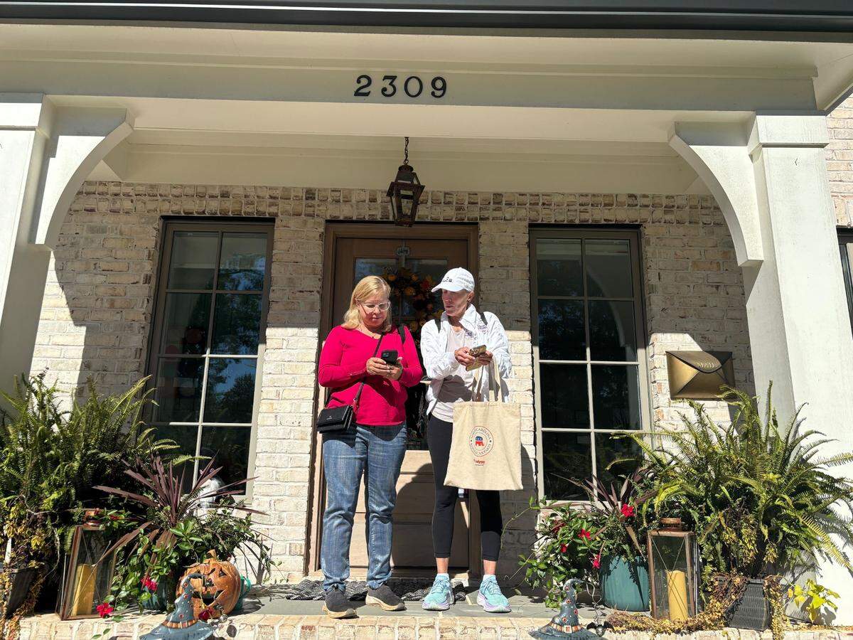 Cynthia Clementi (right) canvasses for the Mecklenburg GOP near South Park on Saturday, Oct. 12, 2024.
