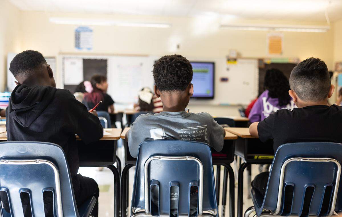 Students get started on their first assignment of the day during the first day of school at Elizabeth Traditional School in Charlotte, N.C., on Monday, August 25, 2025.