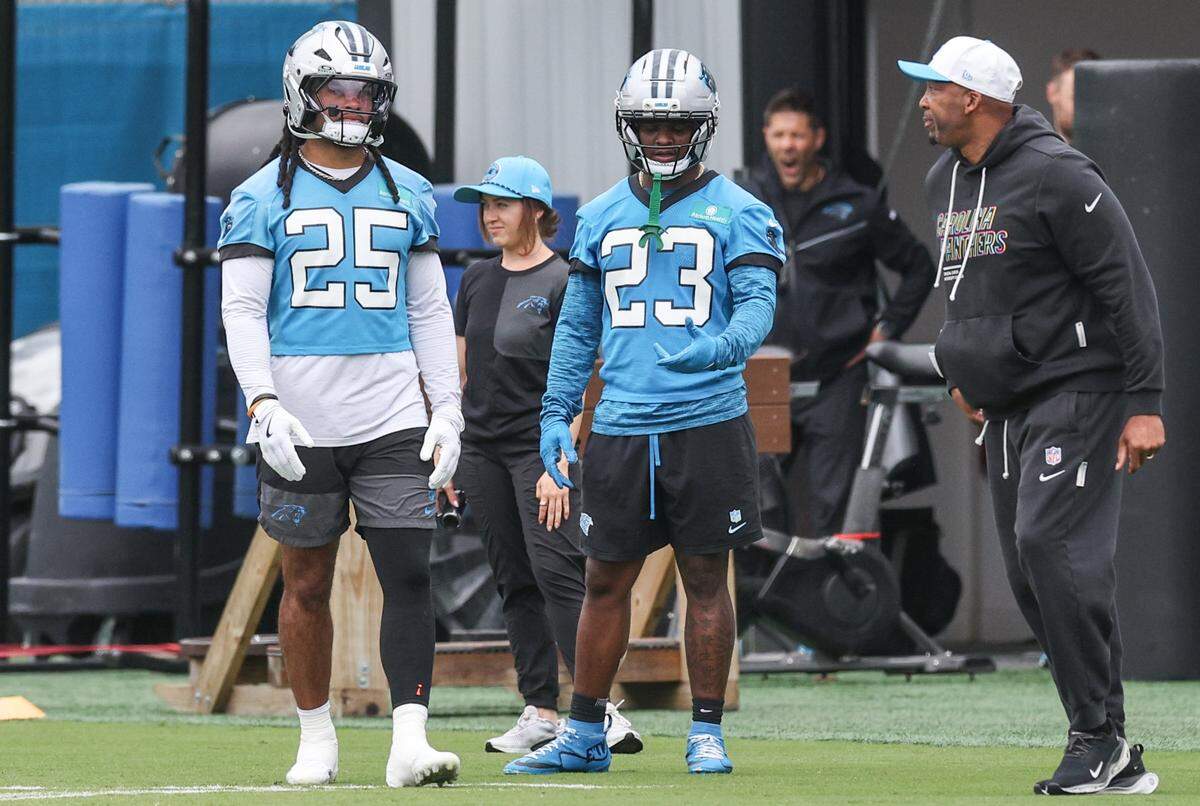 Running backs Jonathon Brooks, left, and Trevor Etienne, center, take part in Carolina Panthers Organized Team Activities on Tuesday, June 2, 2026.