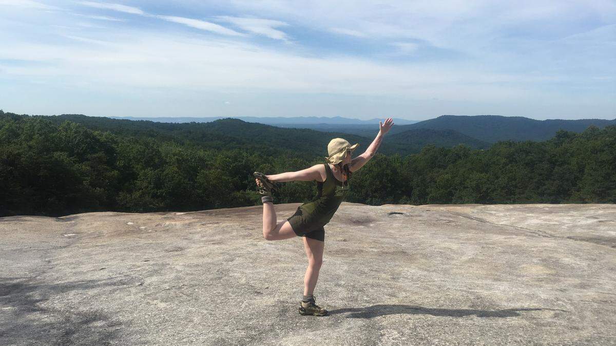 Me doing a dancer pose for the camera at Wolf Rock on Stone Mountain. My friends and I used to do a different day hike every Saturday, and yoga poses at summits became our thing.