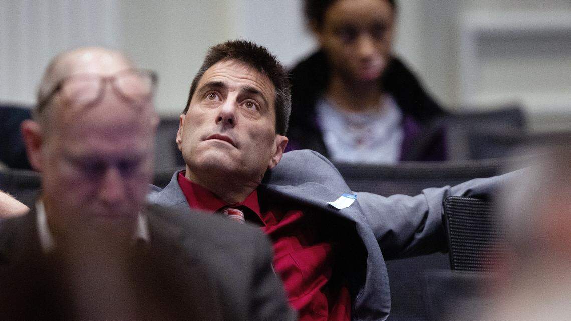 Dallas Woodhouse, executive director of the NC Republican Party, listens to testimony during the third day of a public evidentiary hearing on the 9th Congressional District voting irregularities investigation Wednesday, Feb. 20, 2019, at the North Carolina State Bar in Raleigh.