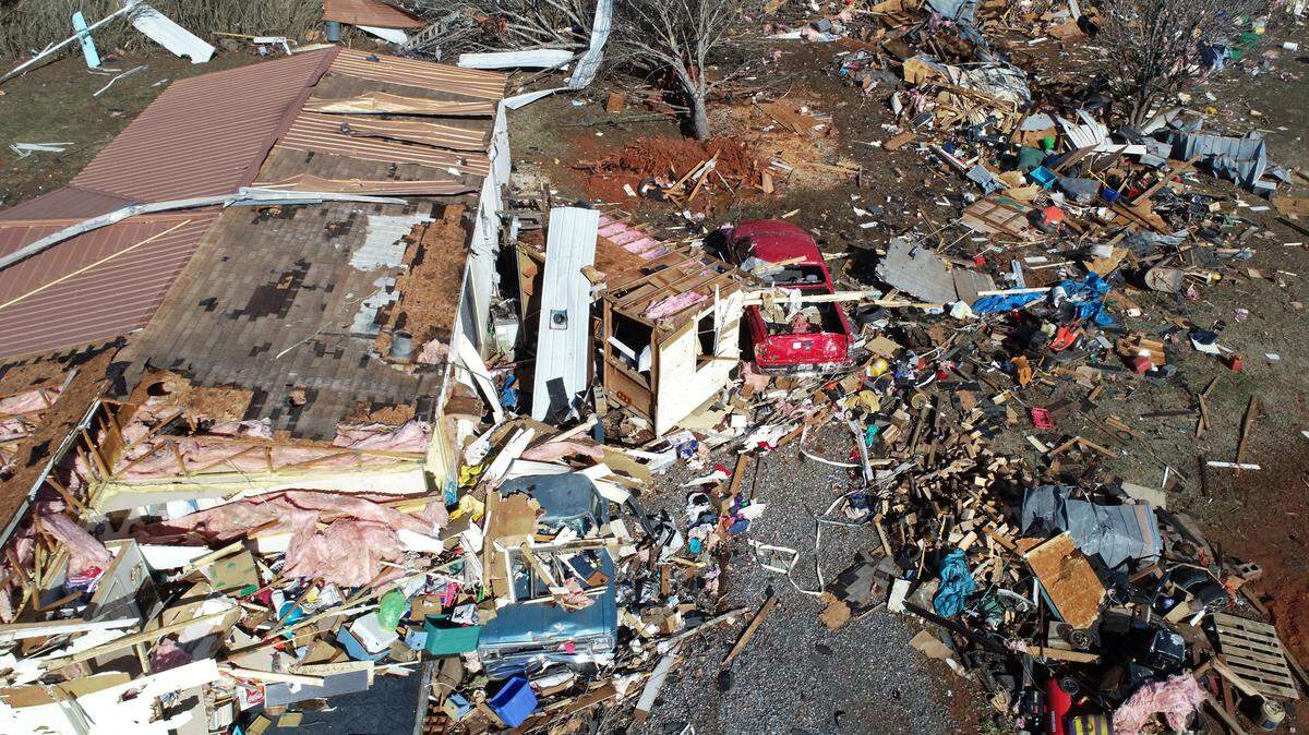 The contents of a mobile home in the Fox Hollow area along Cindi Lane are strewn across the property following a suspected tornado in Claremont, NC on Tuesday, January 9, 2024. The EF-1 tornado was part of a massive storm system that covered much of the southeast on Tuesday and left one dead.