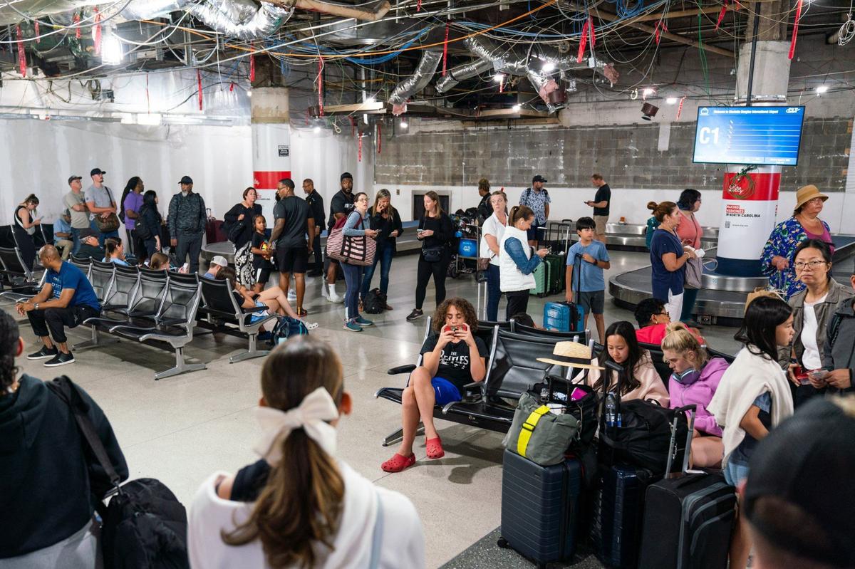 Baggage claim C inside the Charlotte Douglas International Airport on August 5, 2024. The airport is facing many delays and cancelations due to Hurricane Debby’s landfall in Florida.