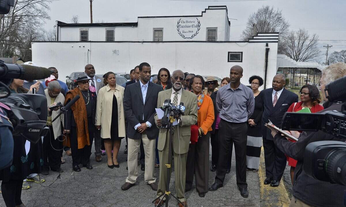 James Ferguson, owner of the Excelsior Club, is surrounded by family and friends as he spoke to reporters outside the club on Beatties Ford Road, Wednesday afternoon, Feb. 22, 2017.Over 73 years Charlotte's historic Excelsior Club has survived economic downturns, racial upheaval and changing ownership. Now it not only faces foreclosure, but nearly $200,000 in federal taxes.
