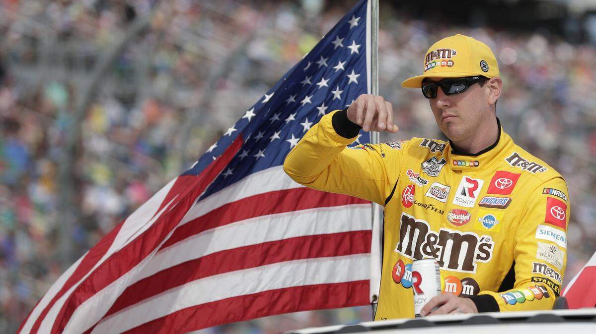 Kyle Busch takes a parade lap in front of fans before the NASCAR Daytona 500 auto race at Daytona International Speedway, Sunday, Feb. 16, 2020, in Daytona Beach, Fla. (AP Photo/John Raoux)