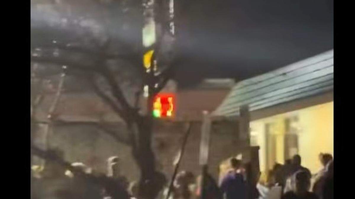 The crowd is seen scurrying from a shooting at the city of Concord NC Christmas tree lighting ceremony on Friday night, Nov. 21, 2025.