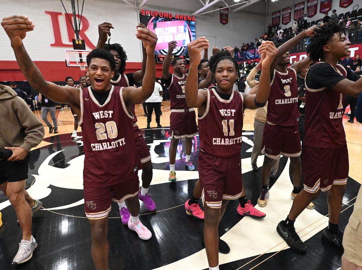 Members of the West Charlotte Lions celebrate their 74-70 victory over West Forsyth in the NCHSAA 8A boys' regional championship game on Wednesday, March 4, 2026 at Lenoir-Rhyne University in Hickory, NC.