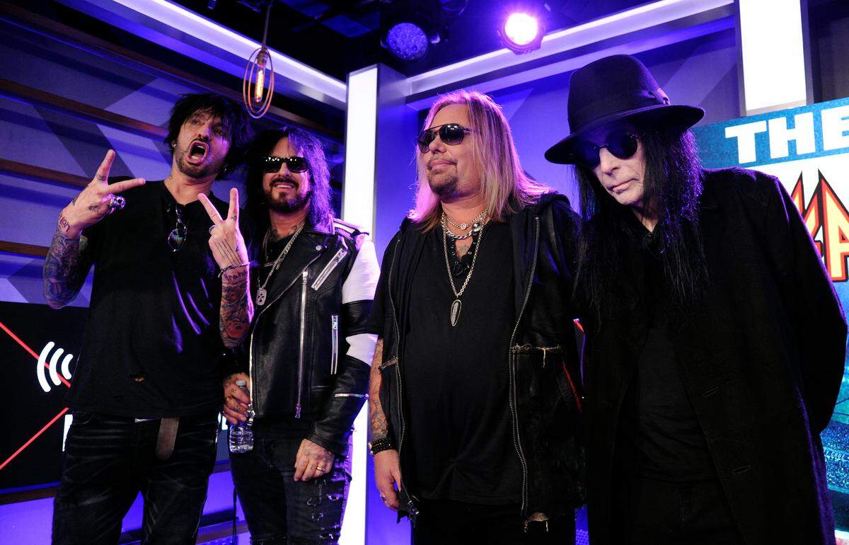 Tommy Lee, from left, Nikki Sixx, Vince Neil and Mick Mars of Motley Crue will join fellow rockers Poison and Def Leppard at Bank of America Stadium this week.
