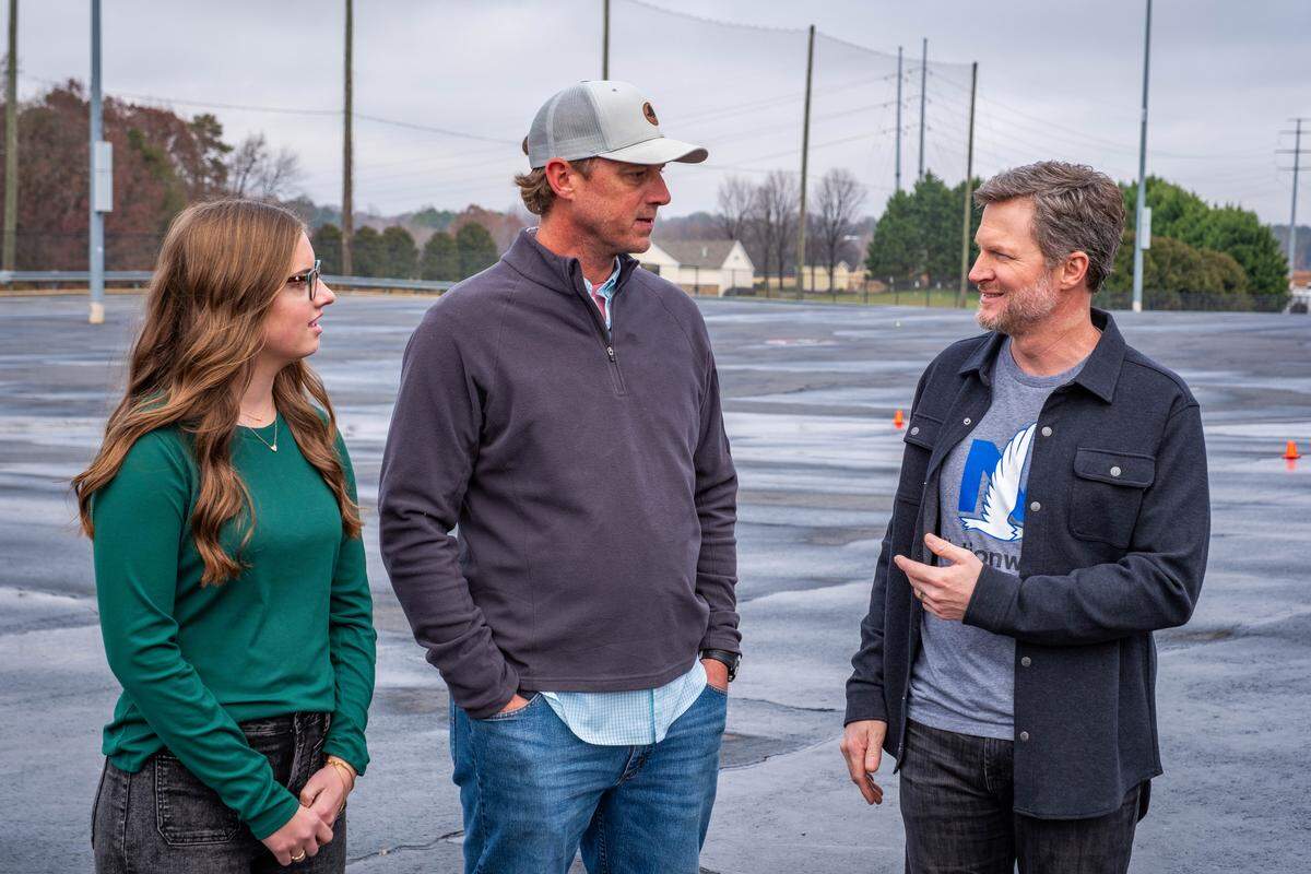 Dale Earnhardt Jr. (far right) talks to high school junior Allie Miller (left) and her father Alan Miller (center) about teenage drivers and the distractions they face.