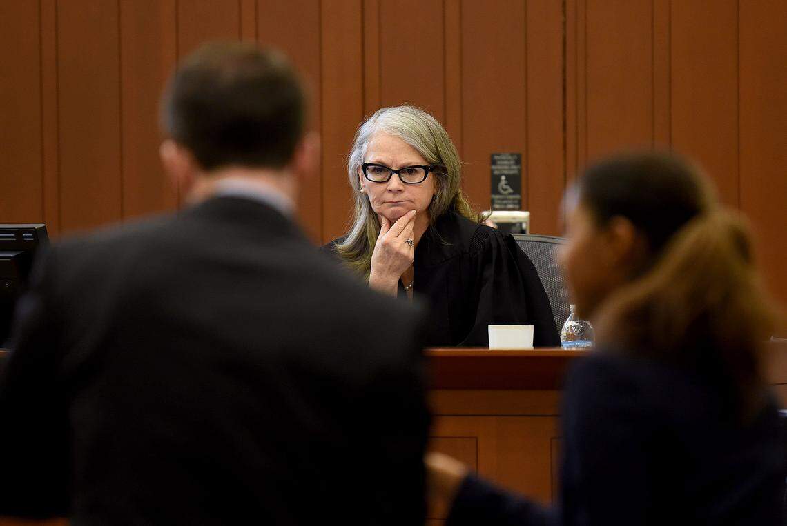 District Judge Paige McThenia considers one of the CMS cases brought before her at a revamped truancy court March 29. It's part of a push to force parents to get serious about getting their kids to school.