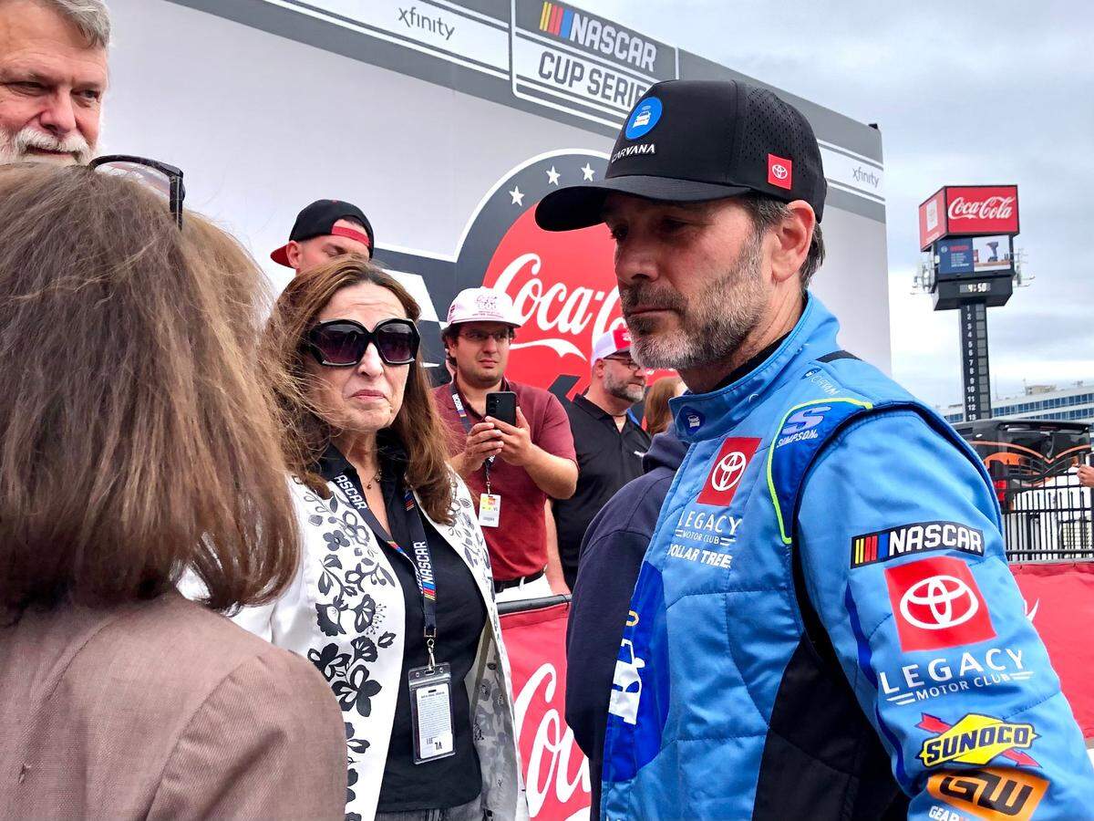 NASCAR Cup Series driver Jimmie Johnson speaks with members of the media after posing for a photograph with his media friends in Victory Lane at Charlotte Motor Speedway in Concord, NC on Sunday, May 25, 2025. Johnson is starting his 700th Cup race in the Coca-Cola 600.