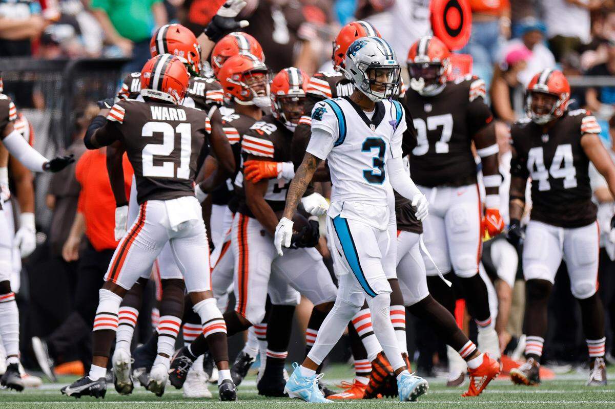 Carolina Panthers wide receiver Robbie Anderson (3) appears dejected as Cleveland Browns players celebrate an interception by Cleveland Browns safety Grant Delpit (22) during a game at Bank of America Stadium in Charlotte, N.C., Sunday, Sept. 11, 2022.
