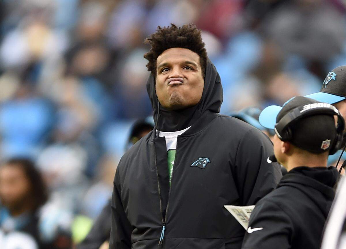 Carolina Panthers’ Cam Newton watches the action from thew sidelines during the second half of an NFL football game against the Atlanta Falcons in Charlotte, N.C., Sunday, Dec. 23, 2018. (AP Photo/Mike McCarn)