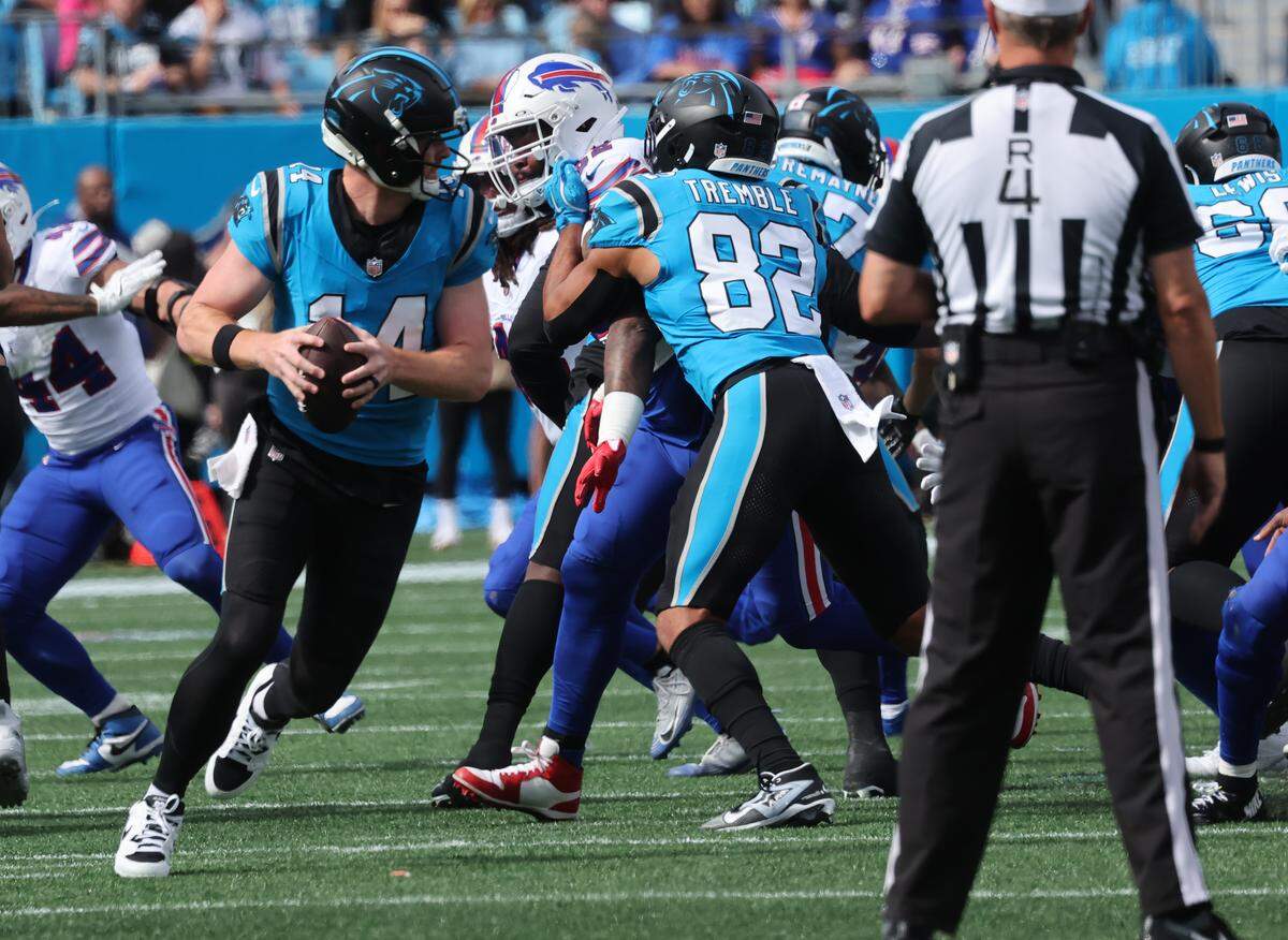 Panthers quarterback Andy Dalton looks for an opening during Sunday’s game at Bank of America Stadium. Dalton ended up going 16-for-24 for 175 yards, with one interception, two lost fumbles and no touchdown passes.