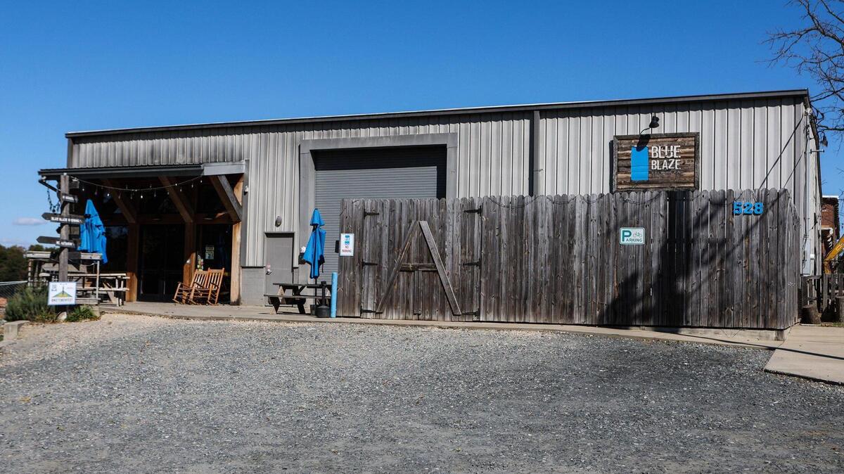 Blue Blaze Brewing sits at the end of the Stewart Creek Greenway near the Seversville neighborhood in west Charlotte. The property where the brewery sits was sold in 2020 to an Atlanta developer. The two have been locked in a lease dispute that’s spilled into public view.