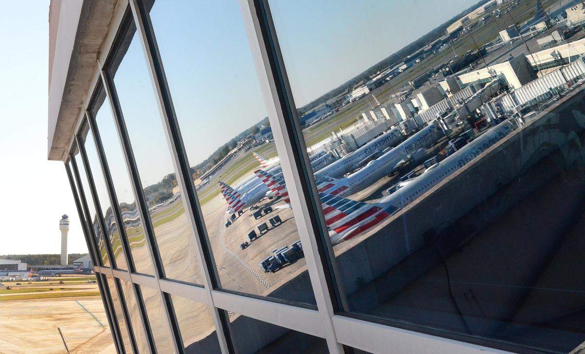 The Charlotte FAA control tower stand off in the distance opposite the American Airlines Hub Control Center. There have been over 2,200 flight delays at CLT in the last 10 days during the government shutdown.