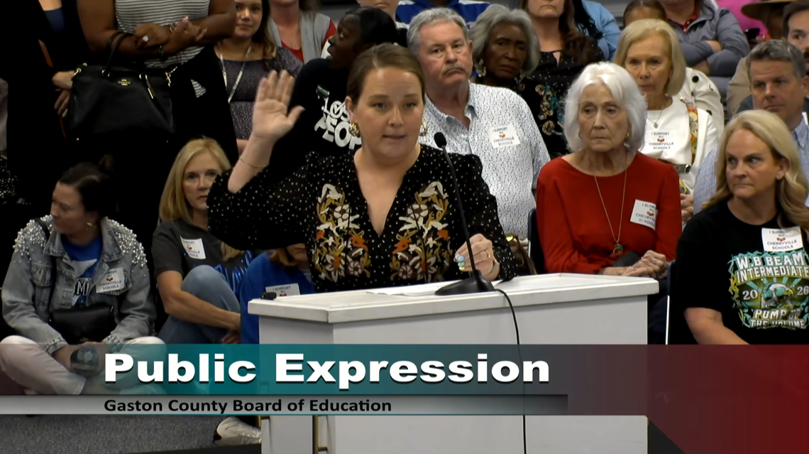 Brittany Elkin speaks to the Gaston County Schools Board of Education Monday during a meeting that packed the room to talk about a post by board member Tod Kinlaw and budget issues plauging the district.