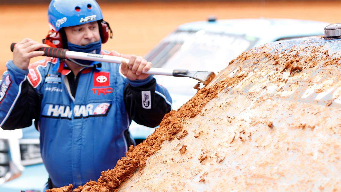A crewmember cleans the windshield of the #52 Halmar International Toyota, driven by Stewart Friesen during qualifying for the NASCAR Camping World Truck Series Pinty’s Truck Race on Dirt at Bristol Motor Speedway on Saturday, March 27, 2021 in Bristol, Tennessee. (Chris Graythen/Getty Images/TNS)