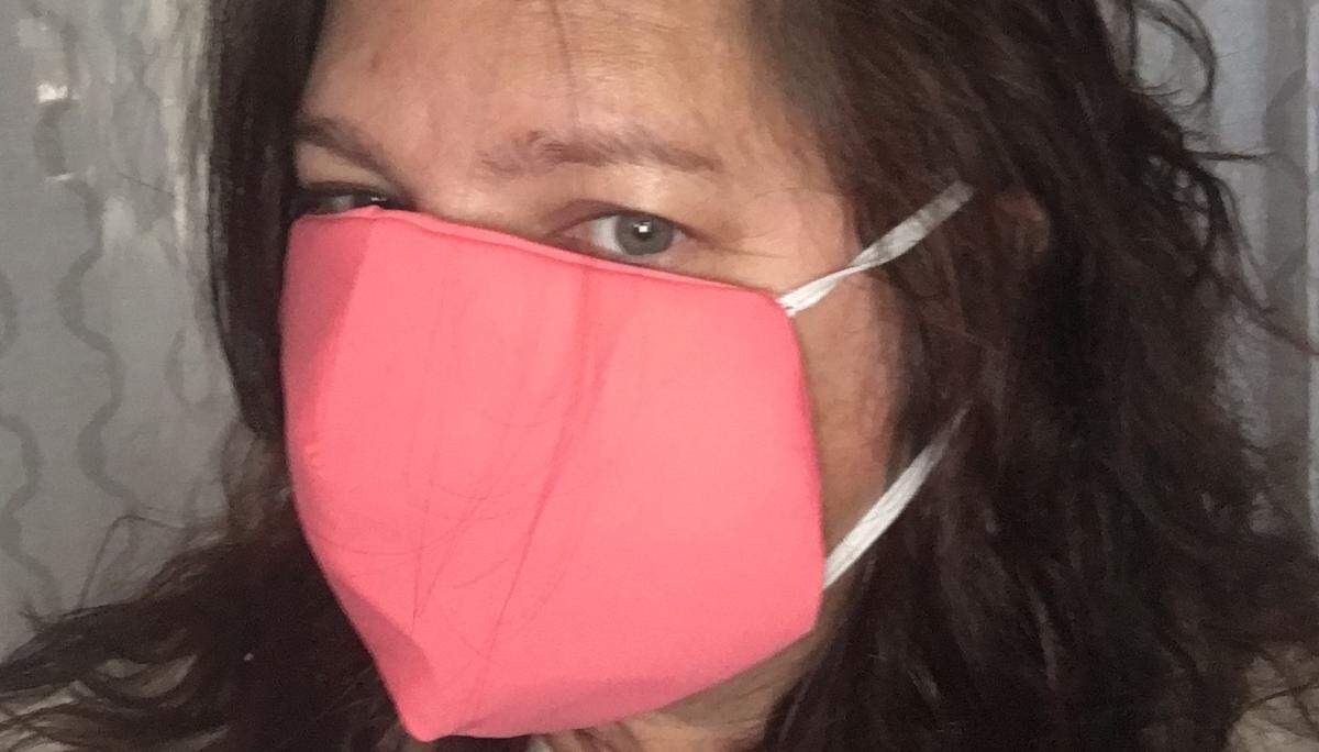 Mariellen Auer got her mask from Custom Apparel Source, which has begun making masks in its Southeast factory.