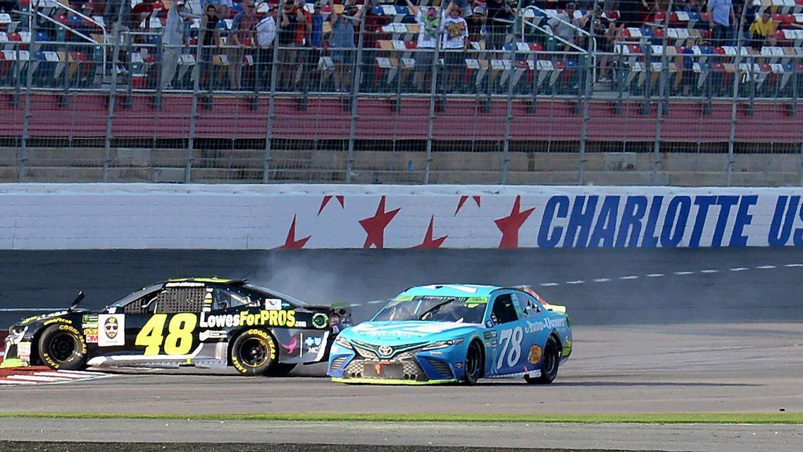 When NASCAR drivers Jimmie Johnson (48) and  Martin Truex Jr. (83) wrecked on the last lap while racing for the victory, it cost Johnson more than a race. The seven-time champion failed to advance to the next round of the playoffs, too.