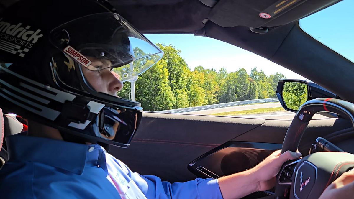 Hendrick Carlson, grandson of NASCAR team owner Rick Hendrick, gives guests a ride around a course during the announcement for the Ten Tenths Motor Club.