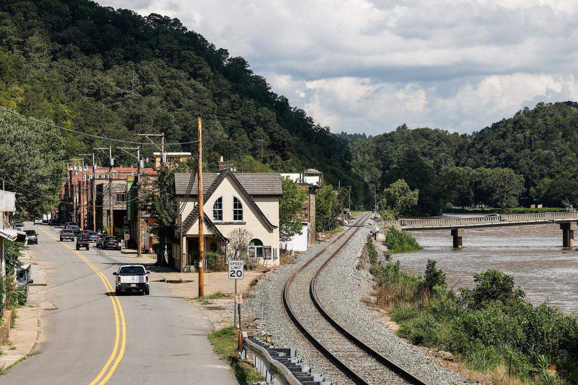 One entrance into downtown Marshall, NC shows the proximity of the small mountain town to the French Broad River, which experienced historic flooding last year during Helene.