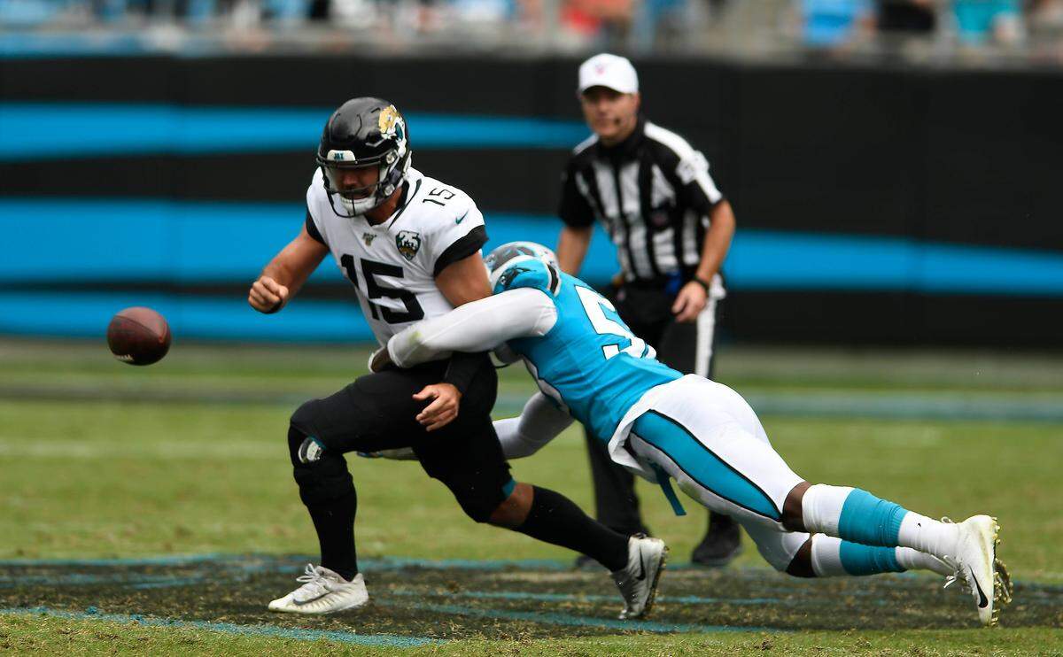 Carolina Panthers linebacker Brian Burns (53) strip-sacks Jacksonville Jaguars quarterback Gardner Minshew (15) in the fourth quarter at Bank of America Stadium in Charlotte, NC on Sunday, October 6, 2019. The Panthers won, 34-27, with Burns also contributing a touchdown on a fumble return.