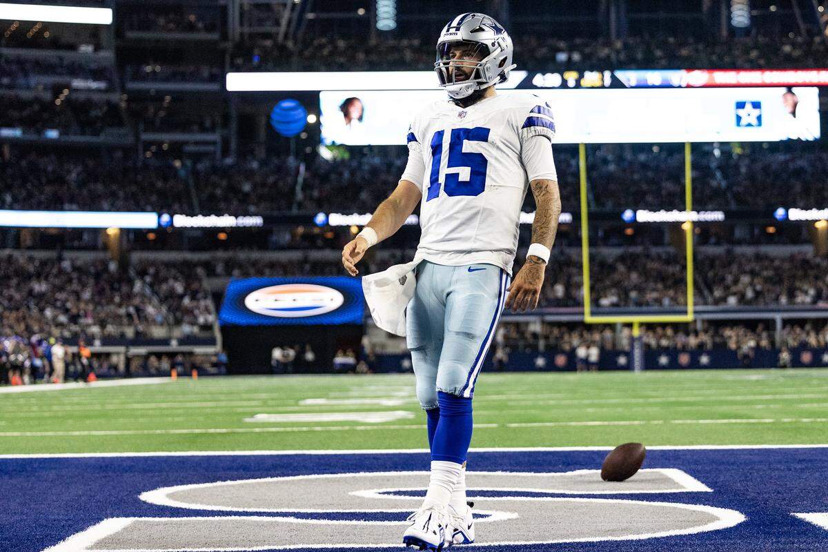 Dallas Cowboys quarterback Will Grier looks at the crowd after running in for a touchdown during a 2023 preseason game against the Las Vegas Raiders in Arlington, Texas.