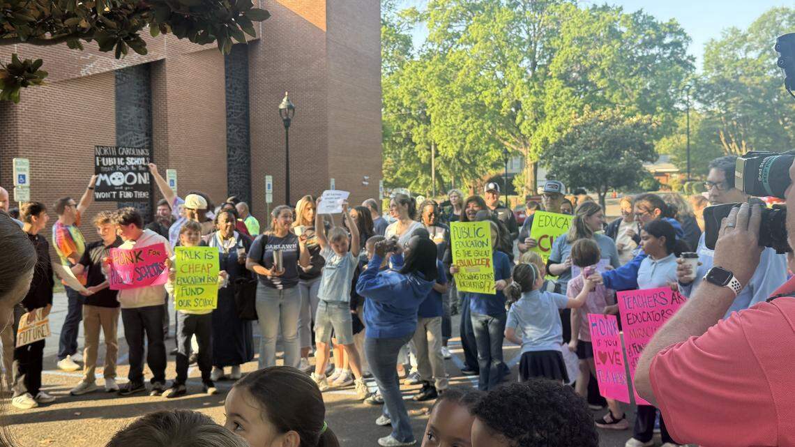 Parents, teachers and students gather across the street from Oaklawn Language Academy on Friday, April 24, 2026.