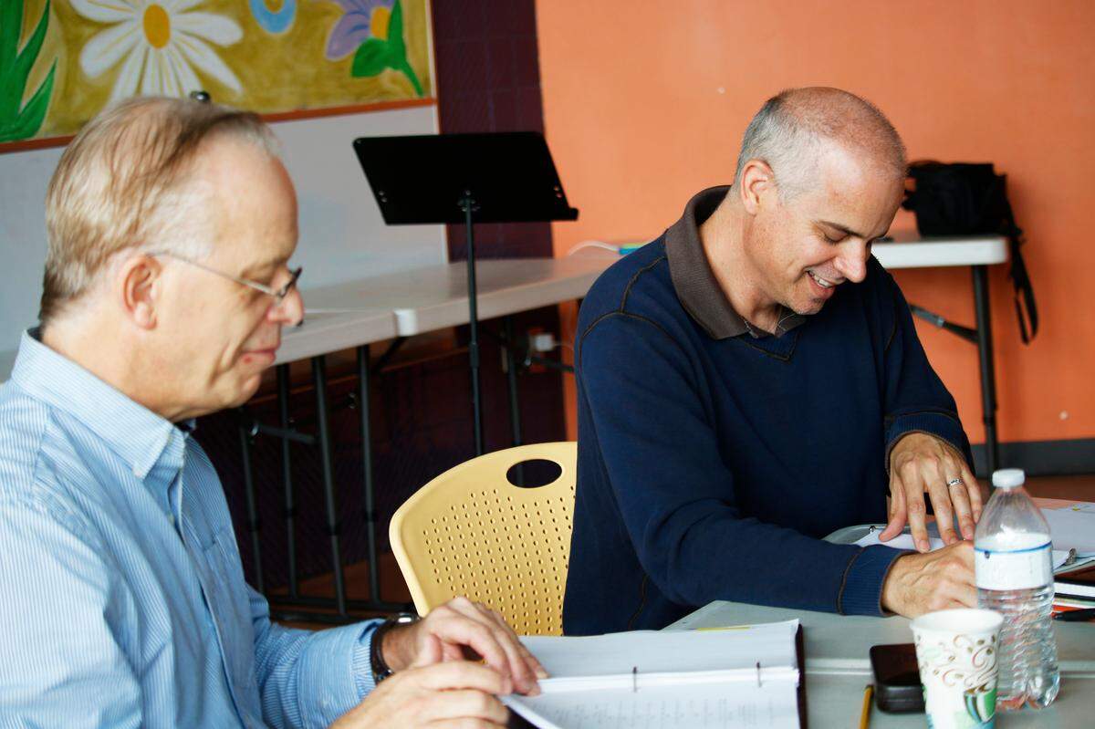 Steven Dietz, left, the playwright for The Second Story Project collaboration with Actor’s Theatre of Charlotte, works with Adam Burke, the artistic director for the Children’s Theatre of Charlotte.