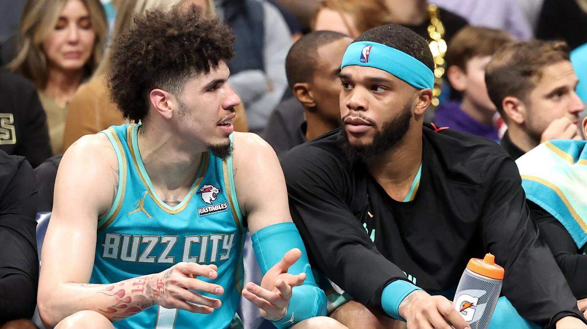 Charlotte Hornets guard LaMelo Ball, left, talks with forward Miles Bridges, right, during first half action against the Milwaukee Bucks on Friday, November 17, 2023 at Spectrum Center in Charlotte, NC.