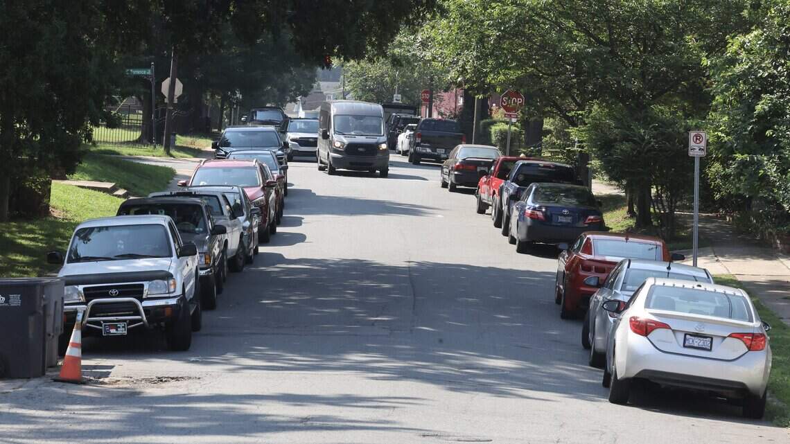 ‘We all suffer.’ New apartment tower floods this Charlotte neighborhood with cars