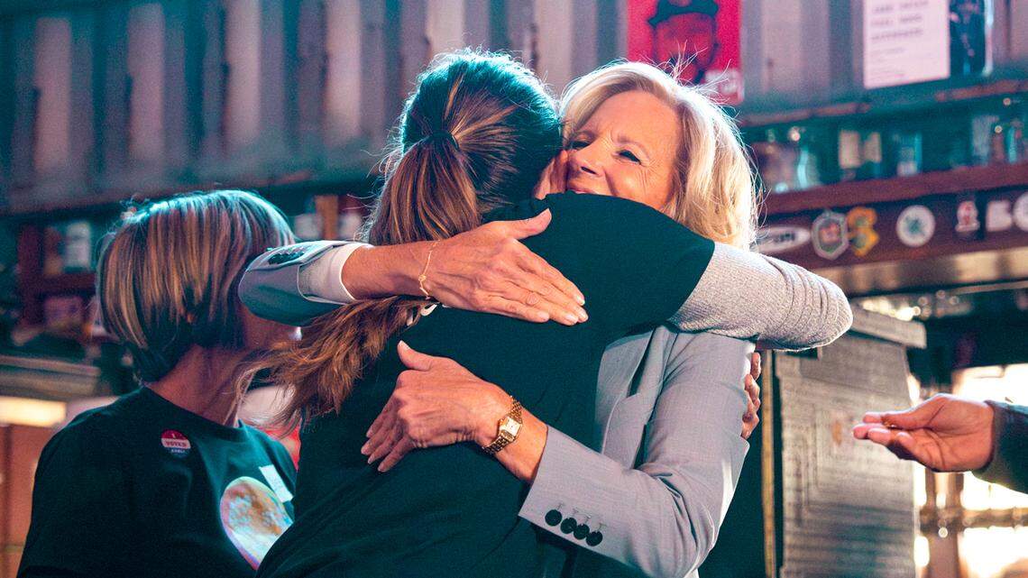 Restaurateur Katie Button and first lady Jill Biden embrace during Hurricane Helene relief efforts.