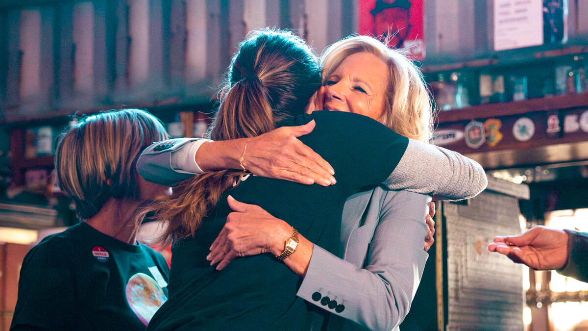 Restaurateur Katie Button and first lady Jill Biden embrace during Hurricane Helene relief efforts.