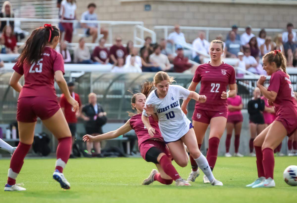 Ashley High defenders surround Ardrey Kell sophomore Makayla Rodriguez at the NCHSAA 4A girls’ soccer state championship game at Matthews Sportsplex on May 31, 2025